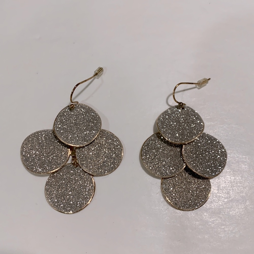 Dangle gold and sparkly silver earrings